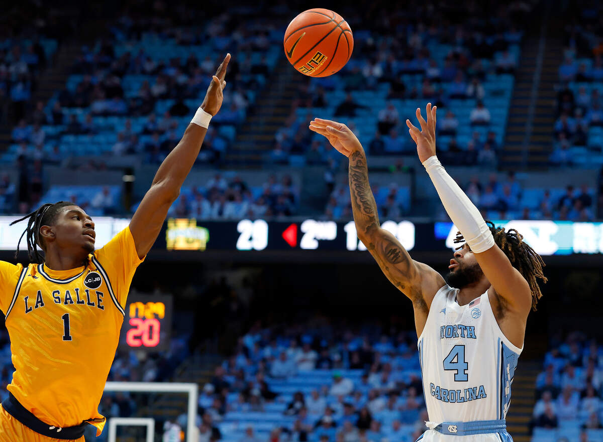 North Carolina’s RJ Davis shoots over La Salle’s Jahlil White during the second half of the Tar Heels’ 93-67 win on Saturday, Dec. 14, 2024, at the Smith Center in Chapel Hill, N.C.