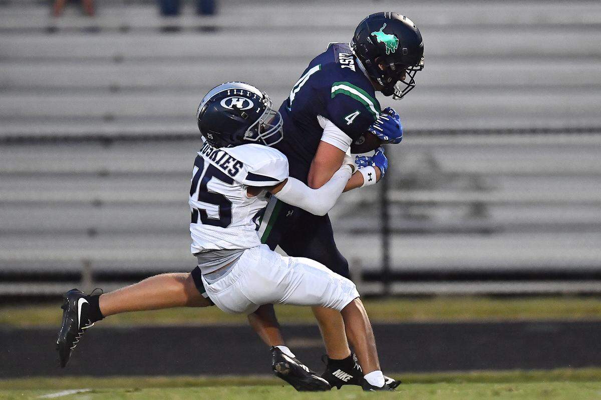 Leesville Road's Evan List (4) has his long run interrupted by  Heritage's Isaac Cook (25) during the first half.  The Leesville Road Pride and the Heritage Huskies met in a  football game in Raleigh, N.C. on September 5, 2025.