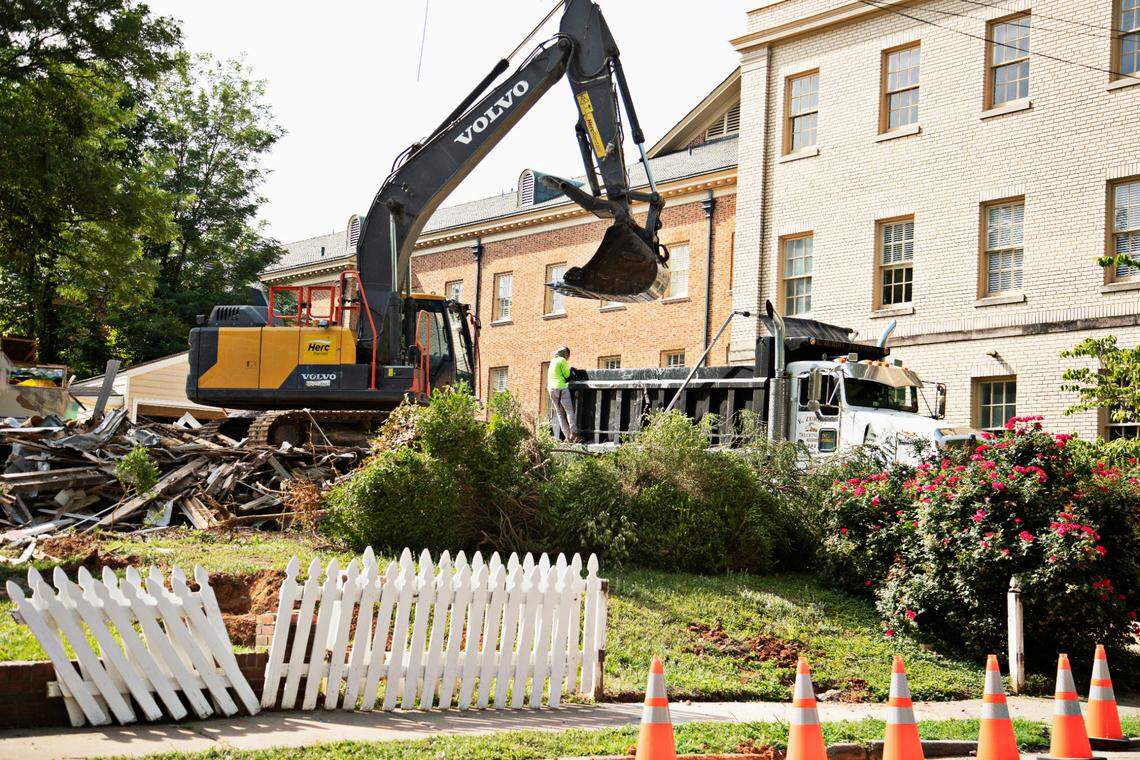 The remnants of three homes on White Oak Road in Raleigh are removed to make way for a parking lot behind Hayes Barton Baptist Church in Raleigh on Tuesday morning, June 7, 2022.