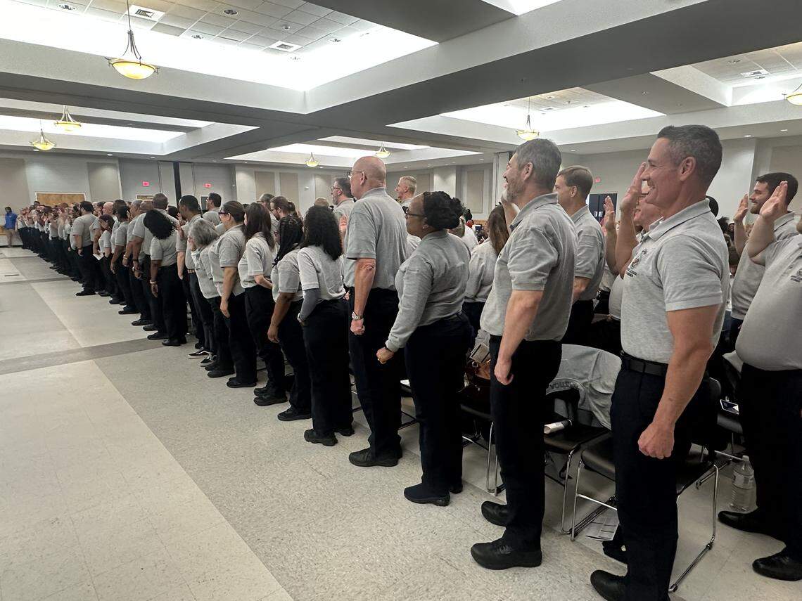 Graduates of the N.C. Division of Motor Vehicles driver license examiner school take the oath of office at Nash Community College on Wednesday, Dec. 17, 2025. The 149 new examiners make up the largest graduating class in DMV history.