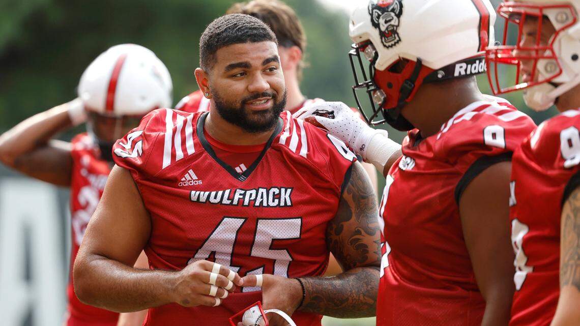 N.C. State’s Davin Vann (45) talks with Savion Jackson (9) during the Wolfpack’s first fall practice in Raleigh, N.C., Wednesday, August 2, 2023.