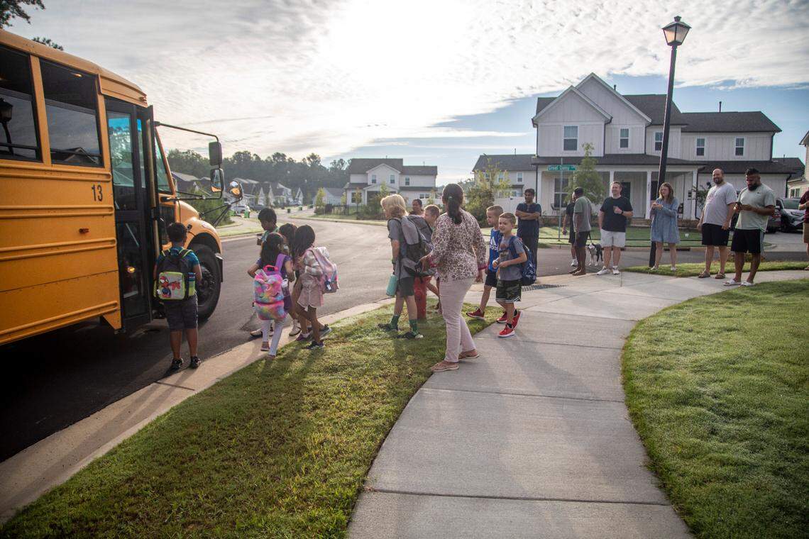 Apex Friendship Elementary School students board a bus Monday morning, Aug. 29, 2022 during the first day of the school’s 2022-2023 school year.