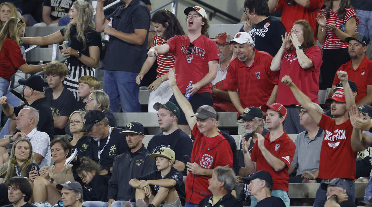 Wolfpack fans cheer on the team during the second half of N.C. State’s 34-24 victory over Wake Forest at Allegacy Stadium in Winston-Salem, N.C., Thursday, Sept. 11, 2025.