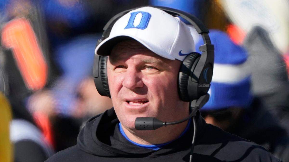 Duke head coach Mike Elko paces the sideline against Pittsburgh during the first half of an NCAA college football game, Saturday, Nov. 19, 2022, in Pittsburgh. (AP Photo/Keith Srakocic)