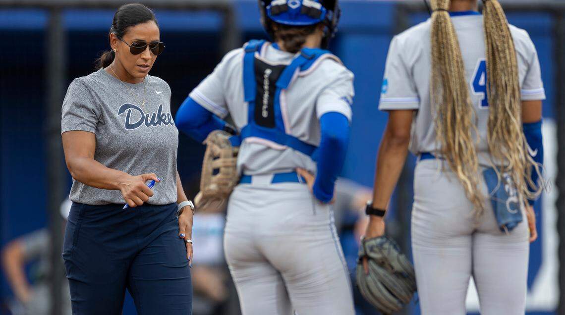 Duke softball coach Marissa Young walks to the mound to confer with catcher Kelly Torres (3) and pitcherJana Wright (14) in the fifth inning against Morgan State during the NCAA Softball Regional at Duke Softball Stadium on Friday, May 17, 2024 in Durham, N.C.