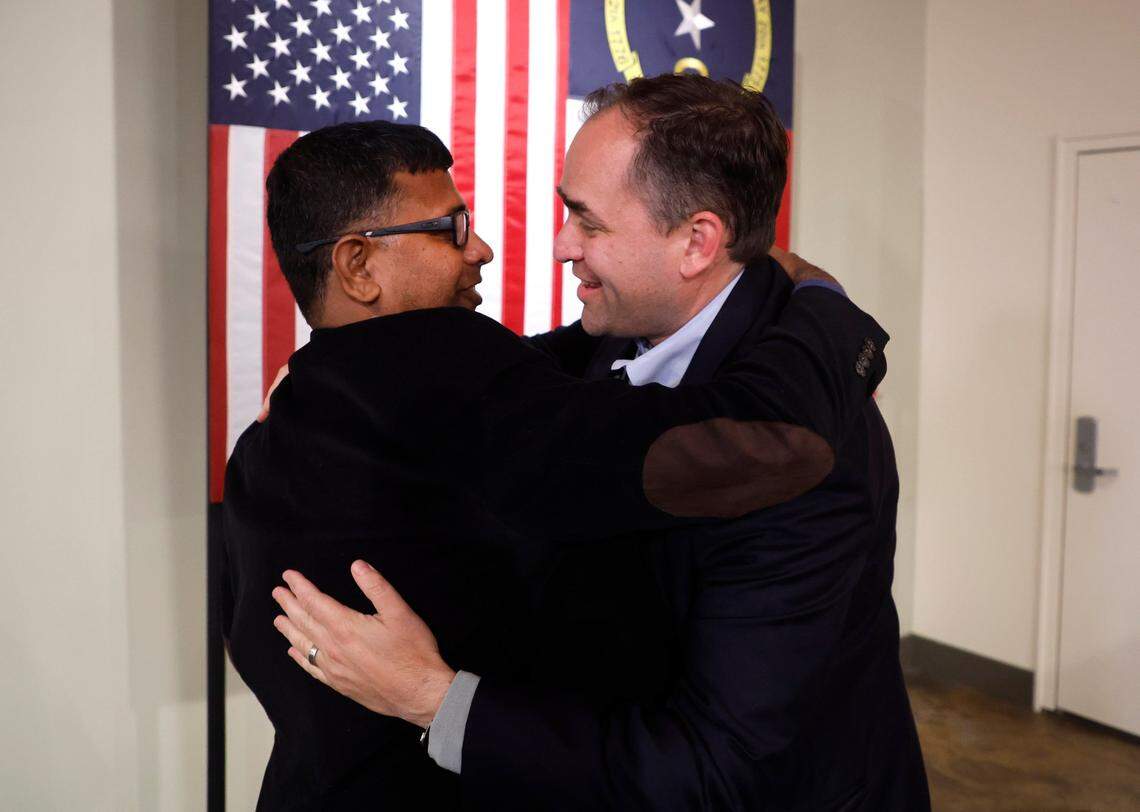 Wiley Nickel hugs Indi Subram after he spoke at a campaign party at Sitti in Raleigh, N.C., Tuesday, Nov. 8, 2022.