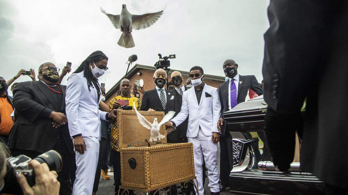 Andrew Brown Jr.’s sons Kahlil Ferebee, left, and Jha’rod Ferebee release doves following the funeral of Andrew Brown Jr. at the Fountain of Life Church in Elizabeth City, NC Monday, May 3, 2021. Brown was shot and killed by Pasqoutank County Sheriff deputies in April.