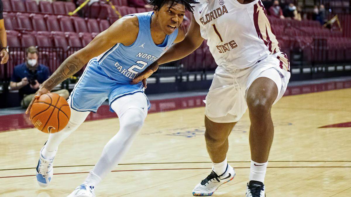 North Carolina’s Caleb Love (2) drives around Florida State’s RaiQuan Gray (1) during UNC’s game against Florida State in Tallahassee, Fla., Saturday, January 16, 2021.