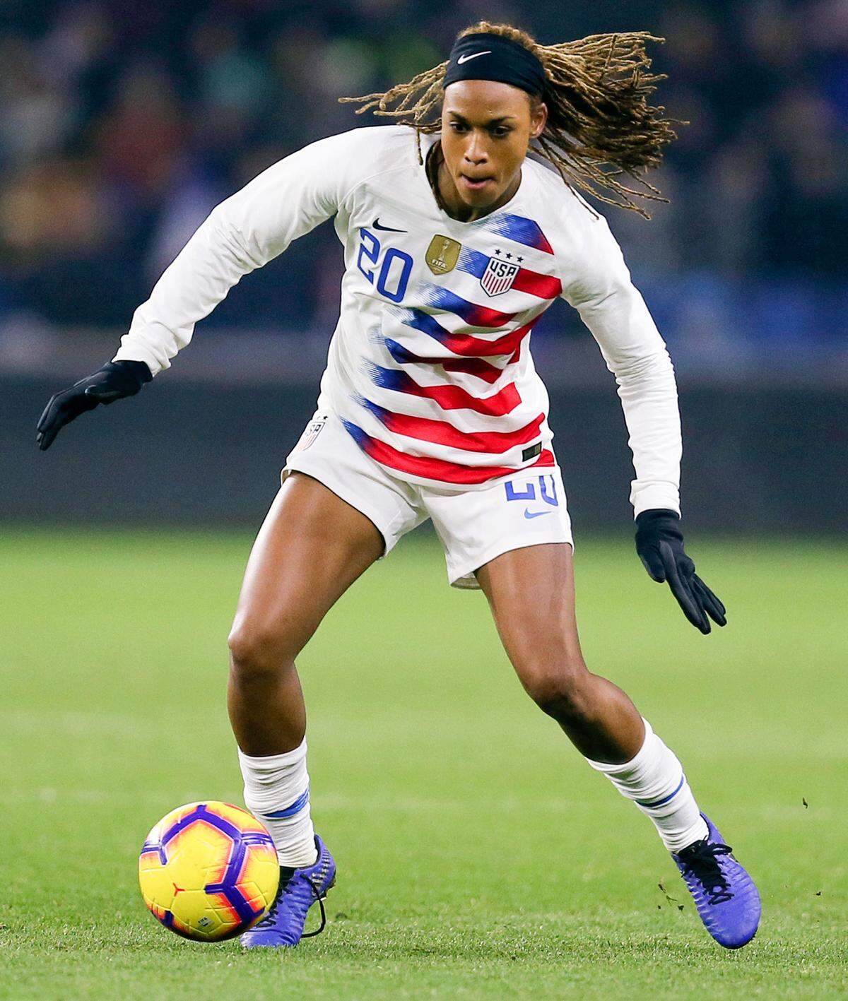FILE - In this Jan. 19, 2019, file photo, United States forward Jessica McDonald controls the ball during a women’s international friendly soccer match againset France at the Oceane stadium in Le Havre, France. There are just a handful of mothers who play professional soccer in the NWSL. But when the league asks players to travel to Utah and be sequestered for more than a month, moms’ voices are important. North Carolina Courage forward Jessica McDonald, whose son Jeremiah is 8 years old. She spoke up to new NWSL Commissioner Lisa Baird and got the moms on a call to discuss the tournament. (AP Photo/David Vincent, File)