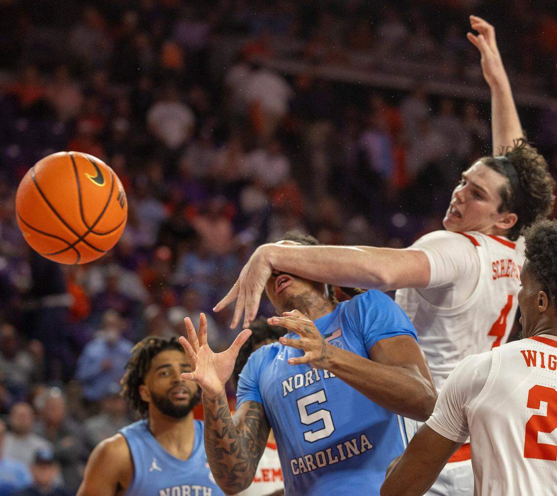North Carolina’s Armando Bacot (5) takes a hit to his face from Clemson’s Ian Schieffelin (4) during the second half on Saturday, January 6, 2024 at Littlejohn Coliseum in Clemson, S.C.