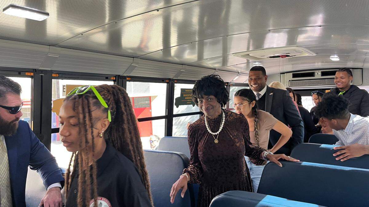 U.S. Rep Valerie Foushee exits an electric school bus outside Durham’s Southern School of Energy and Sustainability on Wednesday, Oct. 23, 2024.