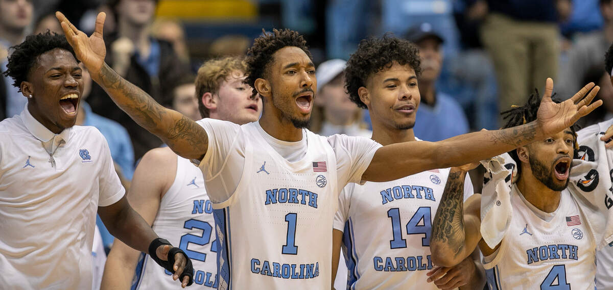 North Carolina’s Leaky Black (1) leads the celebration on the Tar Heels’ bench as the reserve players close in on 100 points in the final minute of play against The Citadel on Tuesday, December 13, 2022 at the Smith Center in Chapel Hill, N.C.