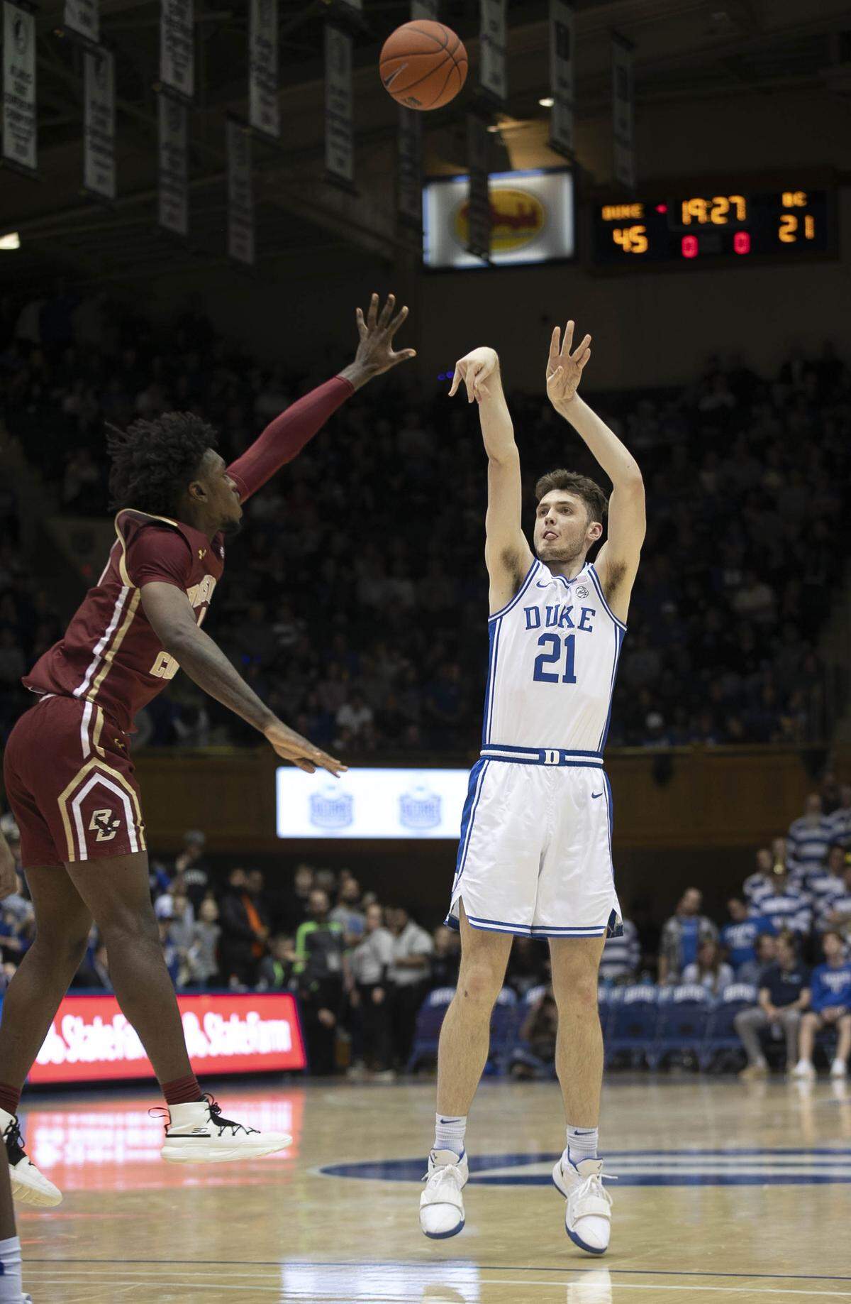 Duke’s Matthew Hurt (21) launches a three-point shot over Boston College’s C.J. Felder (0) in the second half on Tuesday, December 31, 2019 at Cameron Indoor Stadium in Durham, N.C. Hurt was 5 of 10 from the three-point line and lead Duke with 25 point in their 88-49 victory.