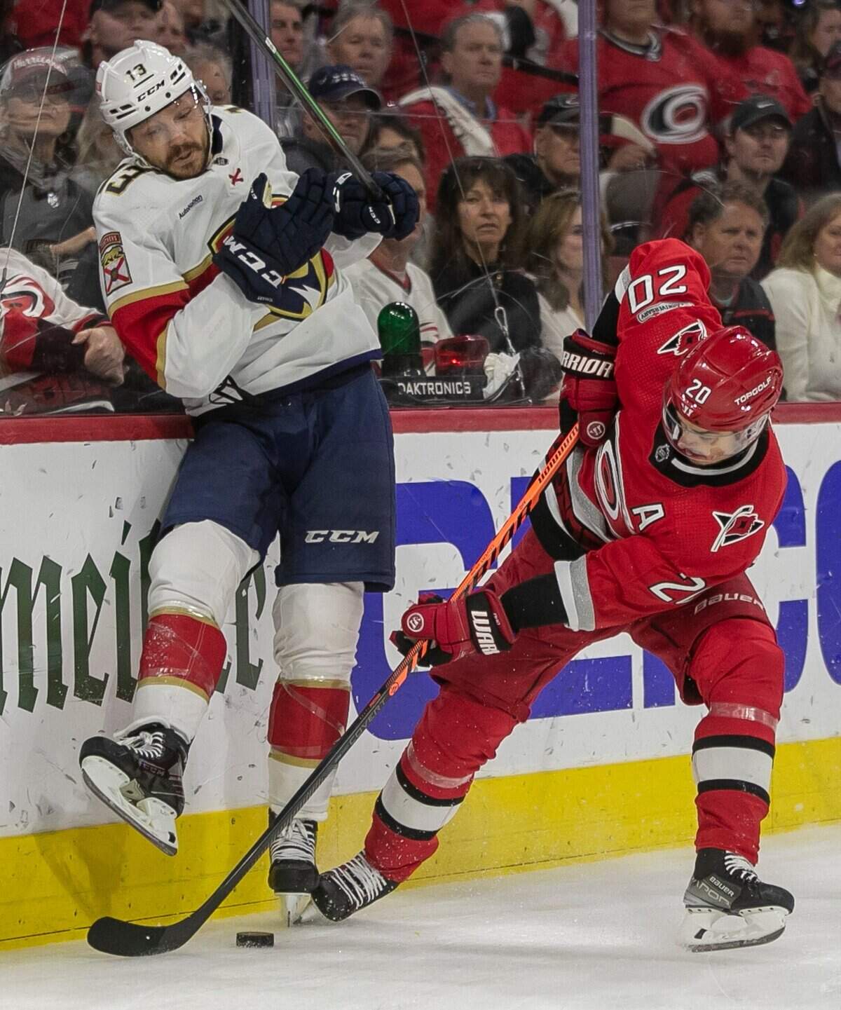 The Carolina Hurricanes Sebastian Aho (20) goes after the puck under the Florida Panthers Sam Reinhart (13) in the first period during Game 1 of the Eastern Conference Finals on Thursday, May 18, 2023 at PNC Arena in Raleigh, N. C.