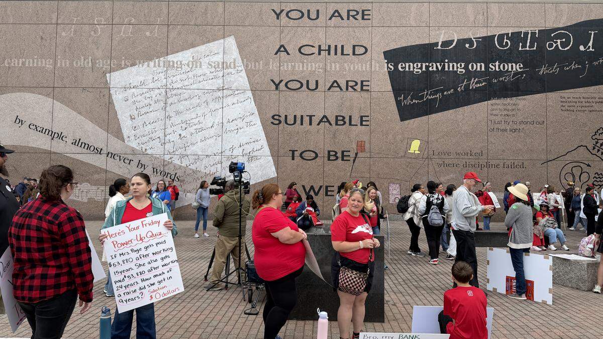 Teachers and supporters begin to gather for a march in downtown Raleigh, Friday, May 1, 2026.