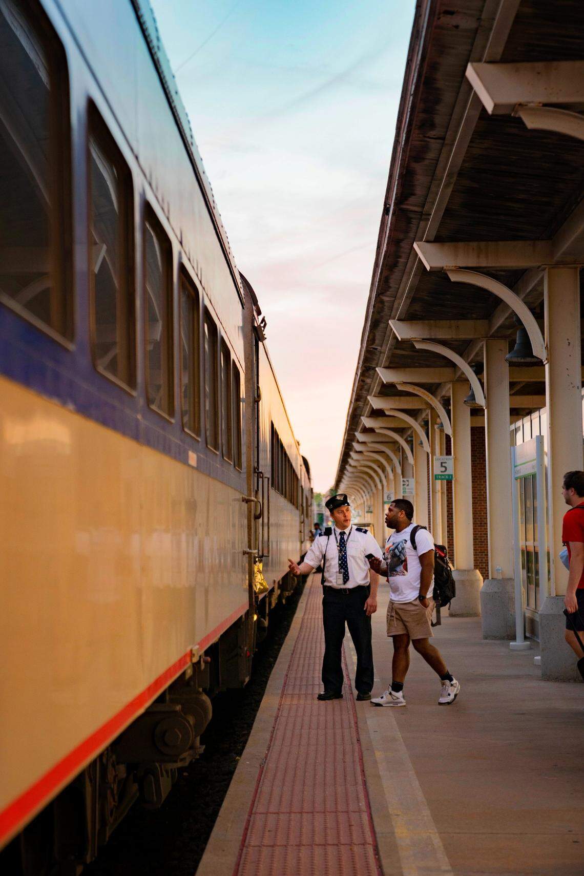 Passengers board the train from Charlotte to Raleigh at the Greensboro station on Sunday, June 5, 2022.