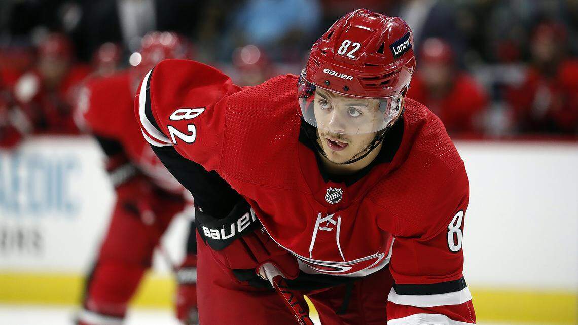 Carolina Hurricanes’ Jesperi Kotkaniemi (82) waits for a face-off against the New York Islanders during the second period of an NHL hockey game in Raleigh, N.C., Thursday, Oct. 14, 2021. (AP Photo/Karl B DeBlaker)