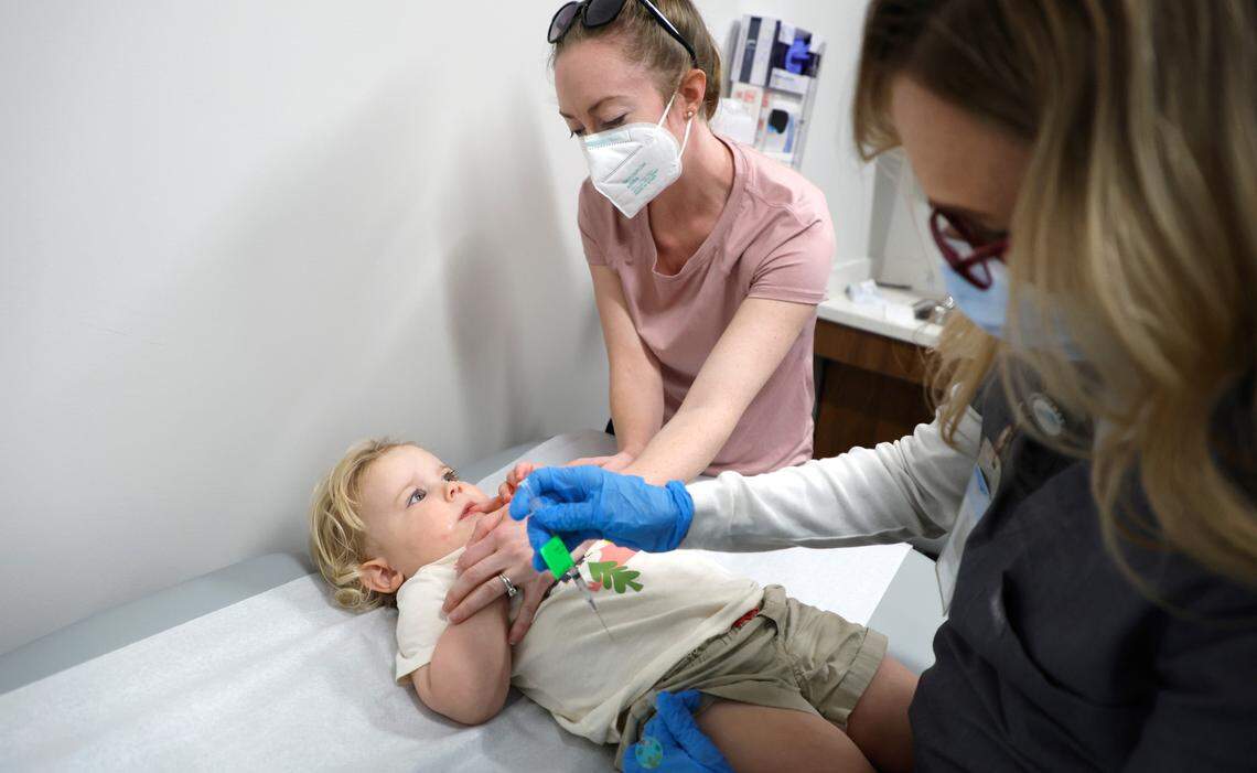 Lynell Batchelor, RN, prepares to give Skylar Boulus, 2, of Cary a Moderna COVID-19 vaccine at UNC Family Medicine & Pediatrics at Panther Creek in Cary, N.C., on Friday, June 24, 2022. With Skylar is her mother, Kathryn. The vaccine was just authorized for children from six months to five years old. “I’ve been looking forward to this day for a very long time,” Boulus said. “This (vaccine) took a little longer but the day finally came.”