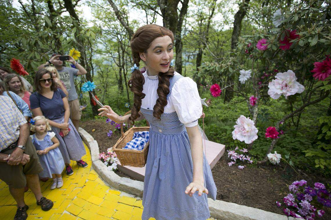 Dorothy take visitors to the Land of Oz atop Beech Mountain for a tour of the yellow brick road during the Journey with Dorothy event on Friday, June 8, 2018.
