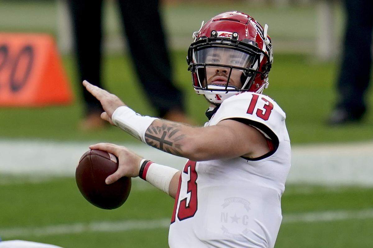 North Carolina State quarterback Devin Leary (13) passes against Pittsburgh in the first half of an NCAA college football game, Saturday, Oct. 3, 2020, in Pittsburgh.