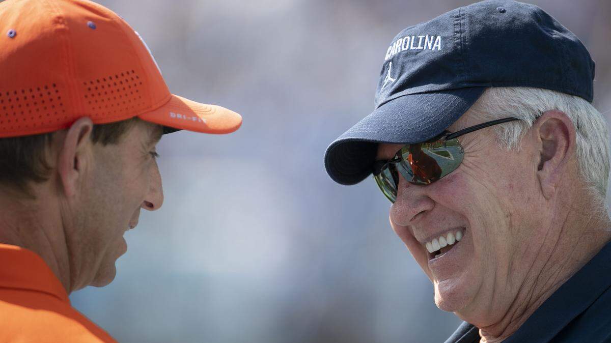 Clemson head coach Dabo Swinney chats with North Carolina coach Mack Brown prior to their game on Saturday, September 28, 2019 at Kenan Stadium in Chapel Hill, N.C.