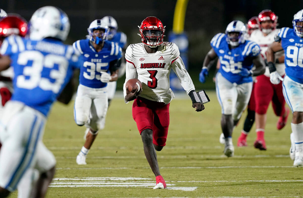 Louisville quarterback Malik Cunningham (3) runs for a touchdown against Duke during the first half of an NCAA college football game in Durham, N.C., Thursday, Nov. 18, 2021.