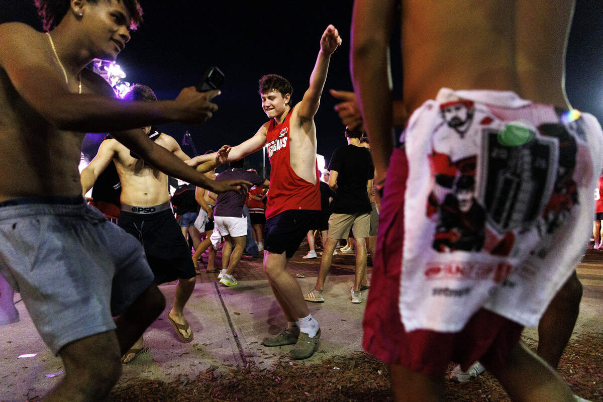 Kooper Vena dances alongside friends during a watch party for game 5 of the Stanley Cup finals outside the Lenovo Center on June 11, 2026, in Raleigh, North Carolina.