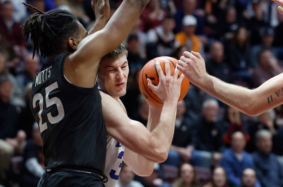 Virginia Tech’s Justyn Mutts (25) defends Duke’s Kyle Filipowski (30) during the second half of Virginia Tech’s 78-75 victory over Duke at Cassell Coliseum in Blacksburg, VA., Monday, Jan. 23, 2023.