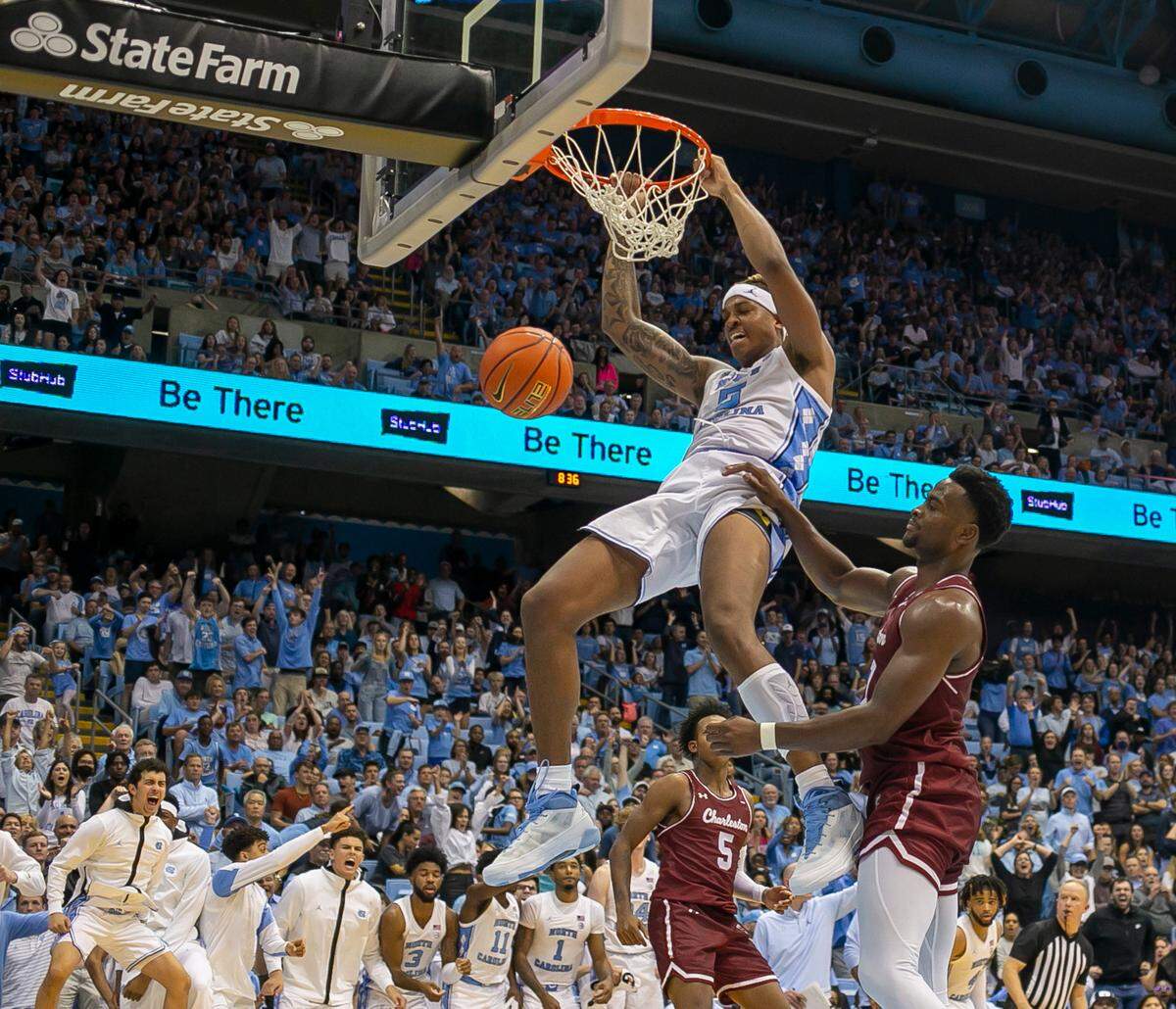 North Carolina’s Armando Bacot (5) dunks over College of Charleston’s Jaylon Scott (21) in the second half on Friday, November 11, 2022 at the Smith Center in Chapel Hill, N.C. Bacot lead all scores with 28 points in the Tar Heels’ 102-86 victory.
