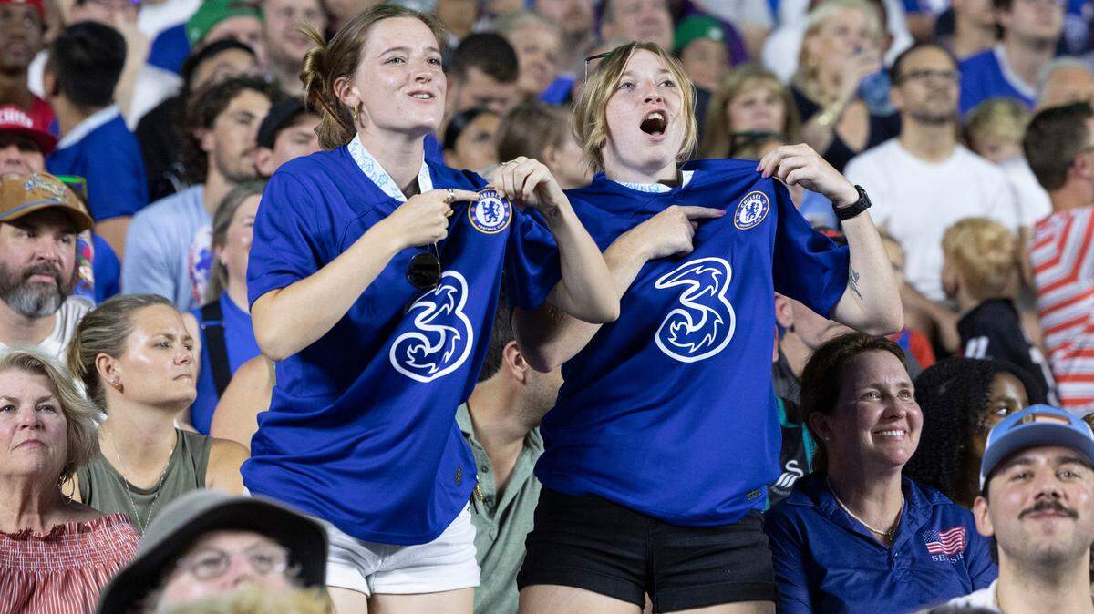 Sarah Stephen, left, from Charlotte, and Jordynne Godsey of McDonough, Georgia celebrate after Chelsea scored during the first half of Chelsea Football Club’s friendly match against Wrexham F.C. at Kenan Stadium in Chapel Hill, N.C., Wednesday, July 19, 2023. The two came just to see the game.