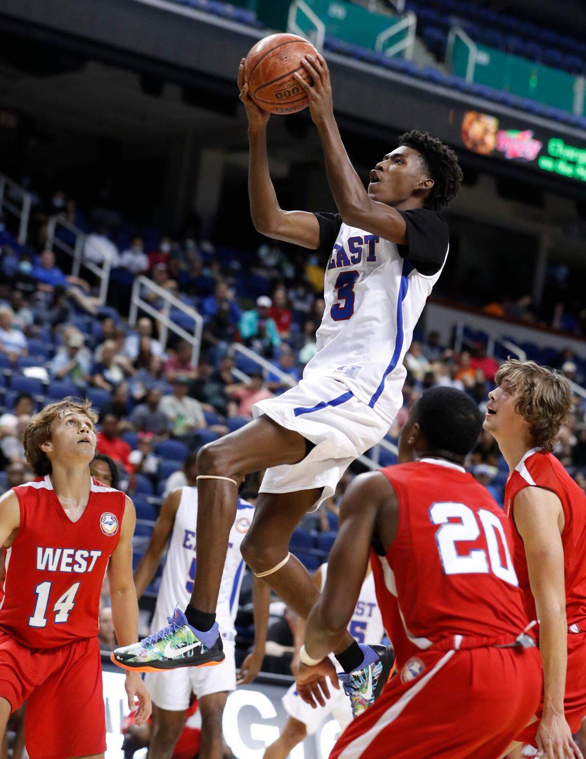 East’s Terquavion Smith (3) heads to the basket during the first half of the North Carolina High School Athletic Association men’s basketball All-Star game at Greensboro Coliseum in Greensboro, N.C., Monday, July 19, 2021.