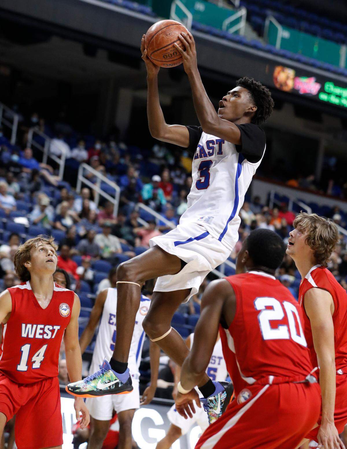 East’s Terquavion Smith (3) heads to the basket during the first half of the North Carolina High School Athletic Association men’s basketball All-Star game at Greensboro Coliseum in Greensboro, N.C., Monday, July 19, 2021.