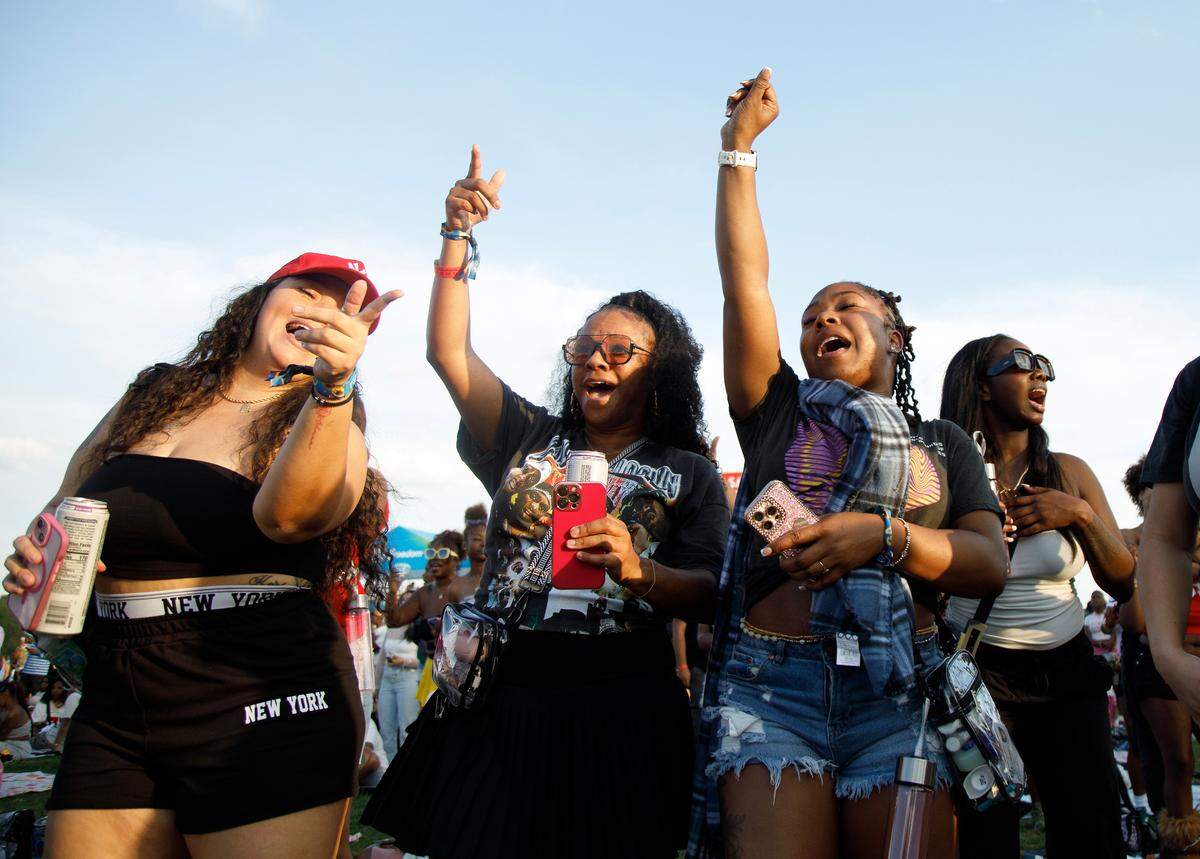 People dance during the fifth Dreamville Festival on Saturday, April 5, 2025, at Dorothea Dix Park in Raleigh, N.C.