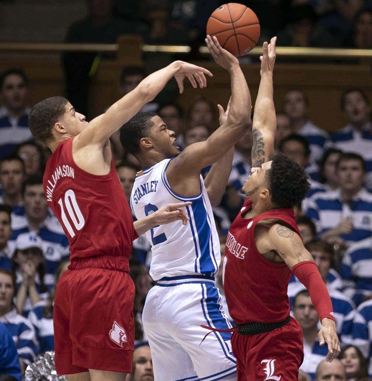 Louisville’s Lamarr Kimble (0) and Samuel Williamson (10) defend Duke’s Cassius Stanley (2) during the first half against Duke on Saturday, January 18, 2020 at Cameron Indoor Stadium in Durham, N.C.
