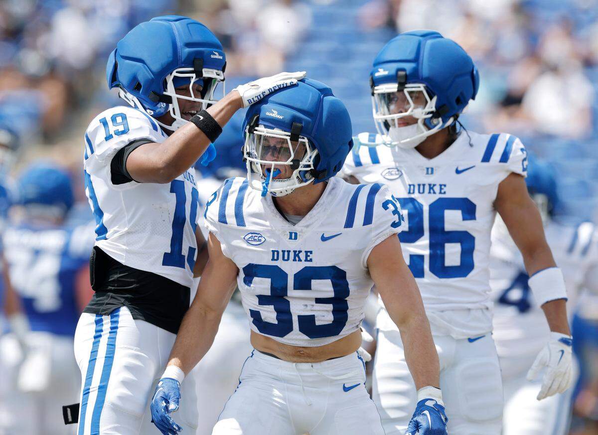 Maliki Wright and Dawson Andrew celebrate following a defensive stop during Duke football’s Blue & White Game on Saturday, April 19, 2025, at Wallace Wade Stadium in Durham, N.C.