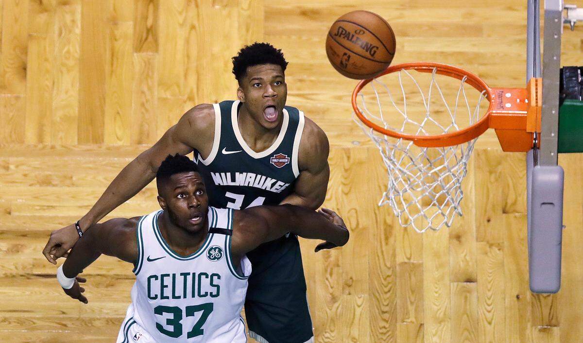 Boston Celtics forward Semi Ojeleye, front, blocks out Milwaukee Bucks forward Giannis Antetokounmpo in Game 7 of the first round of the NBA playoffs on April 28.