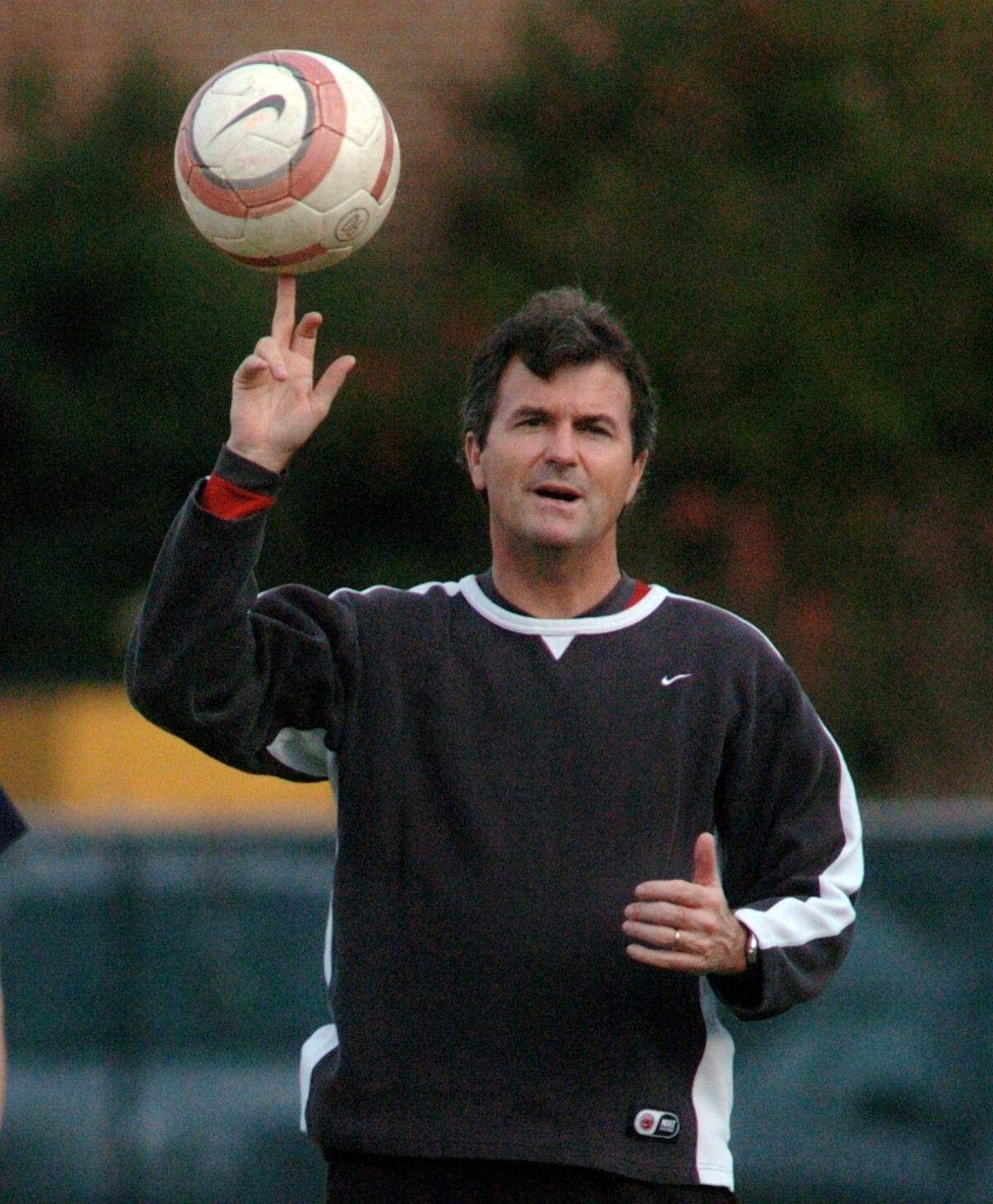UNC head coach Anson Dorrance spins a soccer ball on his finger during practice Wednesday at UNC in 2006.