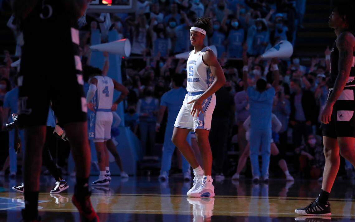 North Carolina’s Armando Bacot (5) heads onto the court before tipoff of UNC’s game against Louisville at the Smith Center in Chapel Hill, N.C., Monday, Feb. 21, 2022.