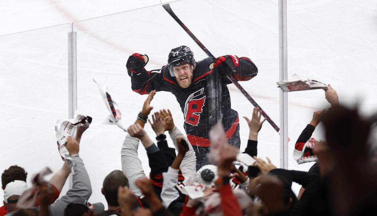 Carolina's Nikolaj Ehlers (27) celebrates after scoring in overtime of the HurricanesÕ 3-2 overtime victory over the Canadiens in game two of the Eastern Conference Finals at the Lenovo Center in Raleigh, N.C., Saturday, May 23, 2026.