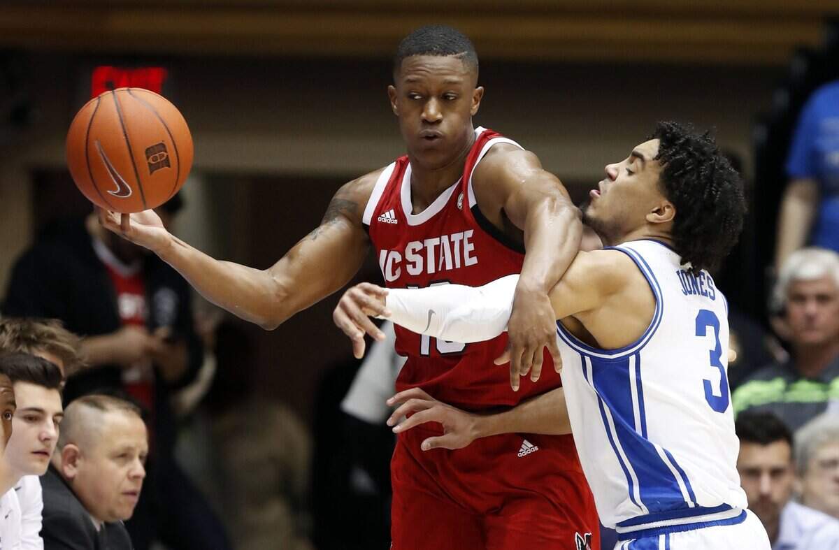Duke’s Tre Jones (3) knocks the ball from the hands of N.C. State’s C.J. Bryce (13) during the first half of the N.C. State Wolfpack’s game against the Duke Blue Devils at Cameron Indoor Stadium in Durham, N.C., Monday, March 2, 2020.