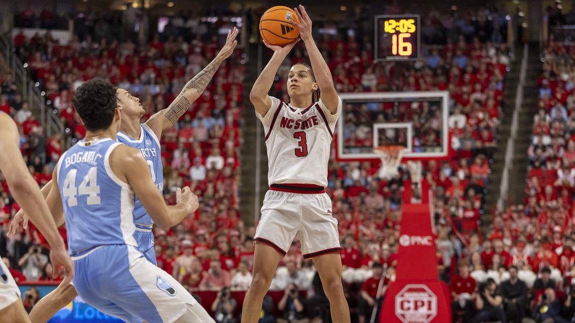 N.C. State forward Matt Able (3) makes a three-point basket to give the Wolfpack an 11 point lead early in the first half against North Carolina on Tuesday, February 17, 2026 at Lenovo Center in Raleigh, N.C.