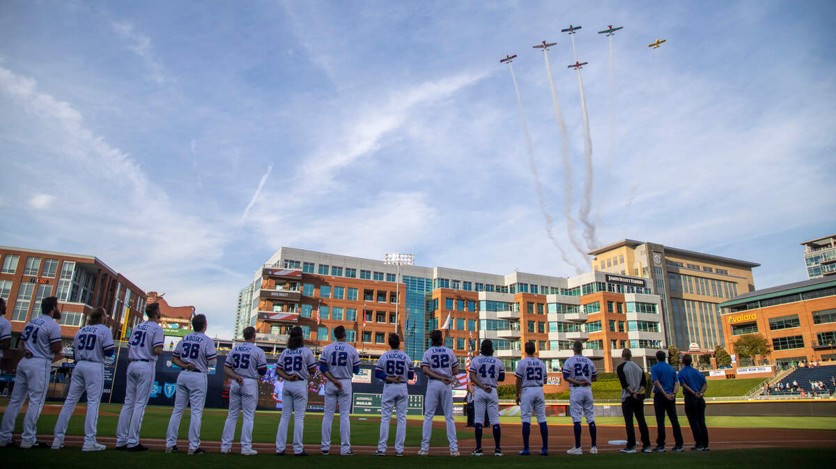 Planes fly over the Durham Bulls Athletic Park following the National Anthem prior to the Bulls’ season opener against the Jacksonville Jumbo Shrimp Tuesday, April 12, 2022.