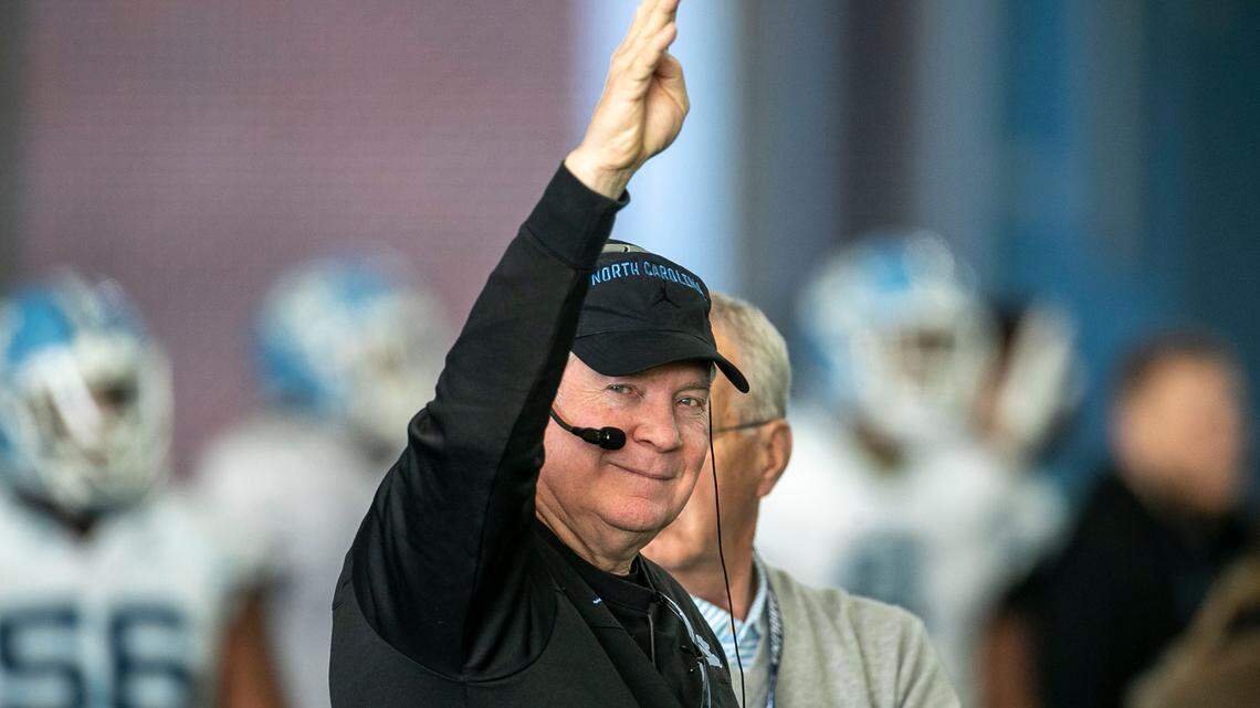 North Carolina coach Mack Brown smiles as he signals for the fourth period of practice during the opening day of spring football on Tuesday, March 1, 2022 in Chapel Hill, N.C.