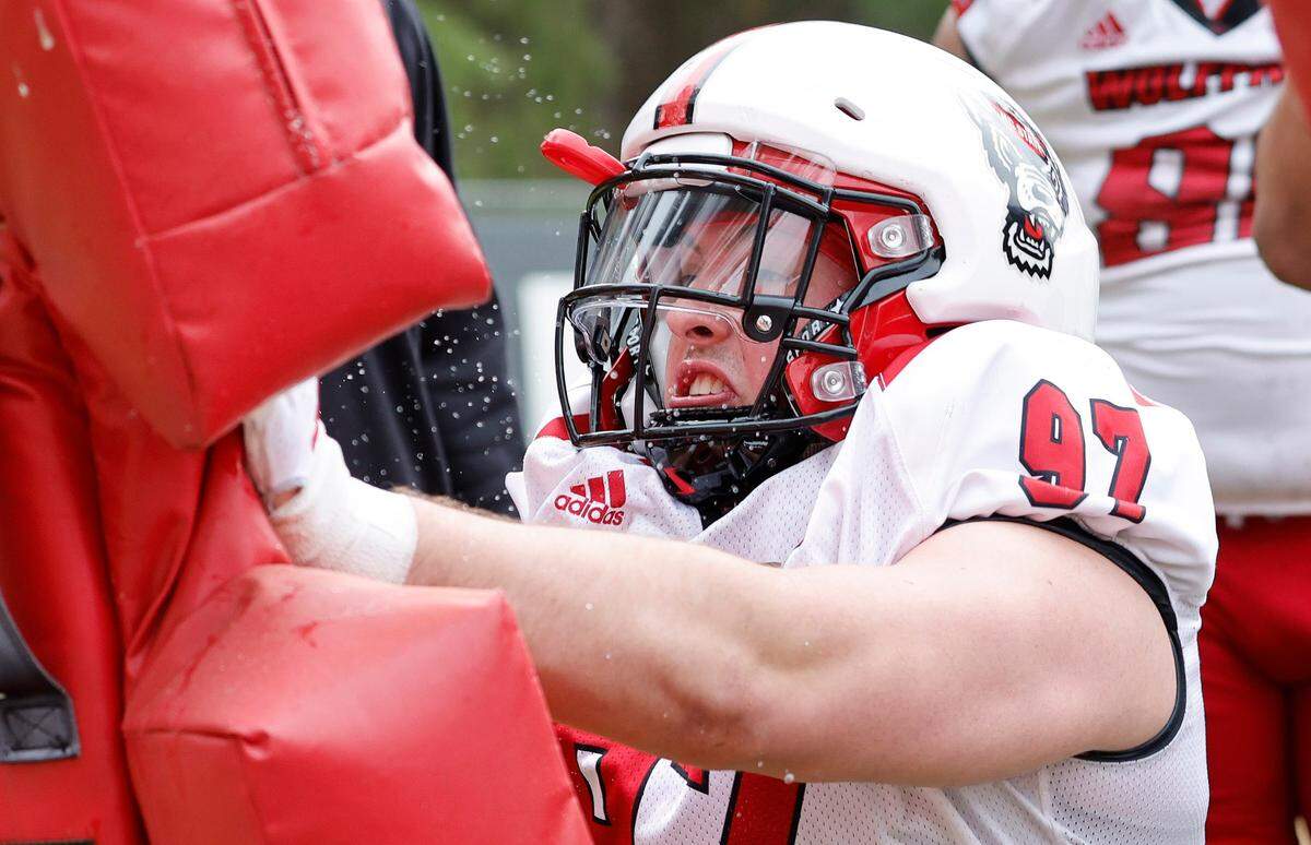 N.C. State defensive lineman Noah Potter (97) runs drills during the Wolfpack’s first spring practice in Raleigh, N.C., Wednesday, March 1, 2023.