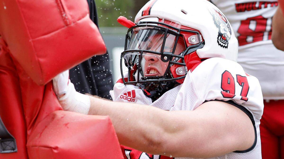 N.C. State defensive lineman Noah Potter (97) runs drills during the Wolfpack’s first spring practice in Raleigh, N.C., Wednesday, March 1, 2023.