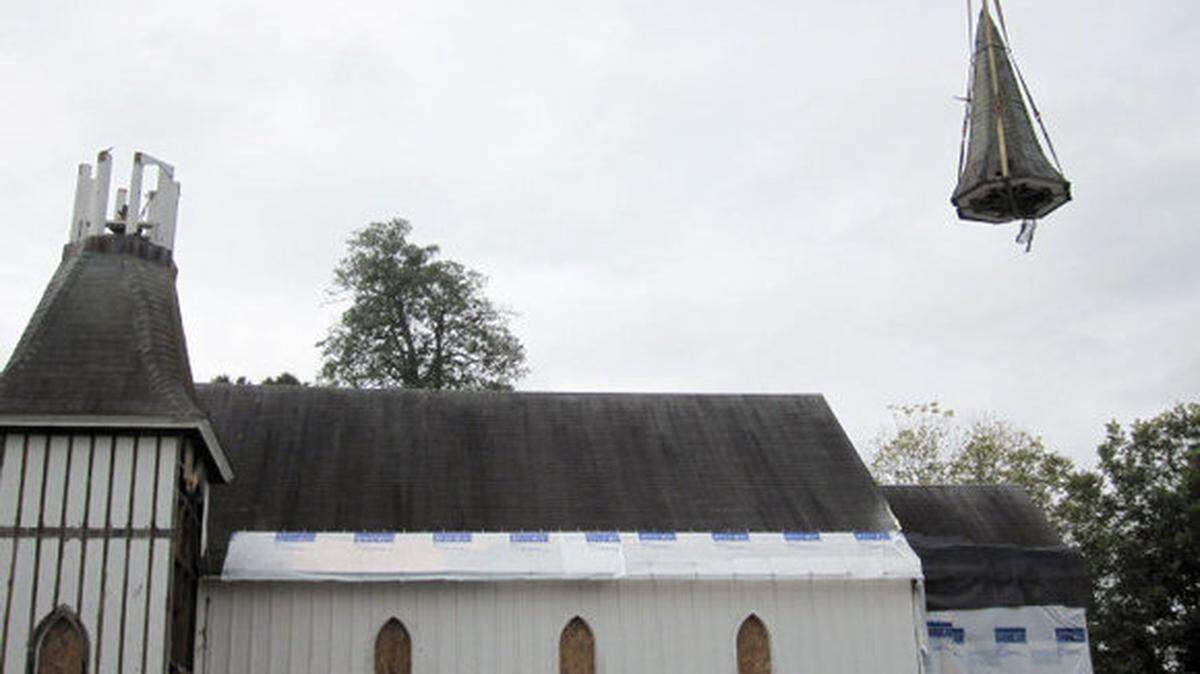 A crane carries away the cap on the steeple of St. Philip’s Church in Germanton. The Episcopal Church of the Advocate has no permanent home yet in Chapel Hill and hopes to begin holding services in the former St. Philip’s by next fall on land it owns off Homestead Road.