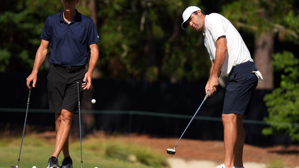 Jun 12, 2024; Pinehurst, North Carolina, USA; Scottie Scheffler putts on the 2nd green during a practice round for the U.S. Open golf tournament at Pinehurst No. 2. Mandatory Credit: Katie Goodale-USA TODAY Sports
