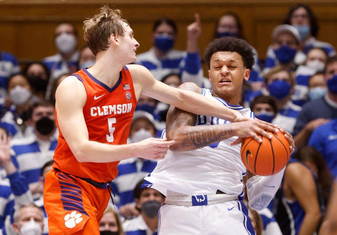 Duke’s Paolo Banchero (5) pulls in a rebound from Clemson’s Hunter Tyson (5) during the second half of Duke’s 71-69 victory over Clemson at Cameron Indoor Stadium in Durham, N.C., Tuesday, January 25, 2022.