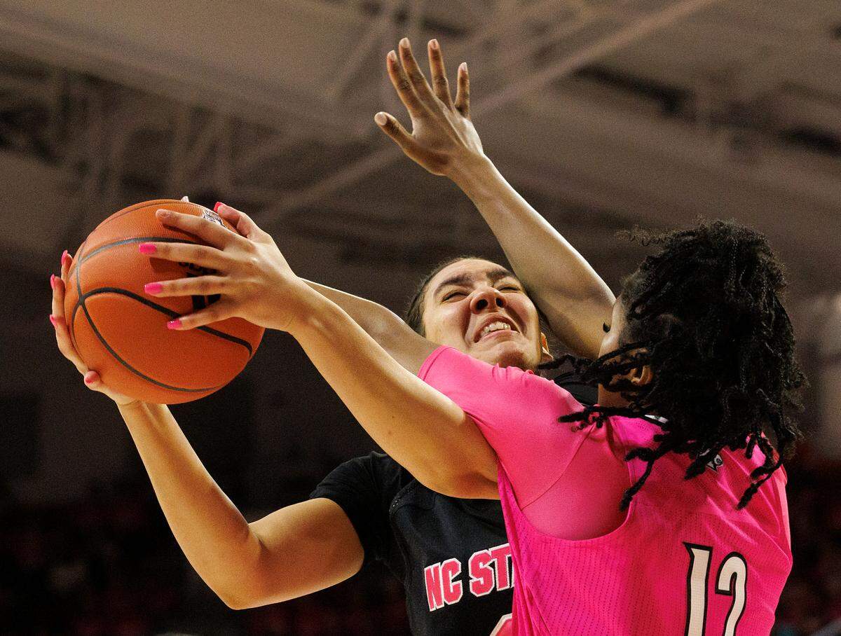 N.C. State’s Mimi Collins shoots over Louisville’s Kiki Jefferson during the second half of the Wolfpack’s 77-67 win on Monday, Feb. 5, 2024, at Reynolds Coliseum in Raleigh, N.C.