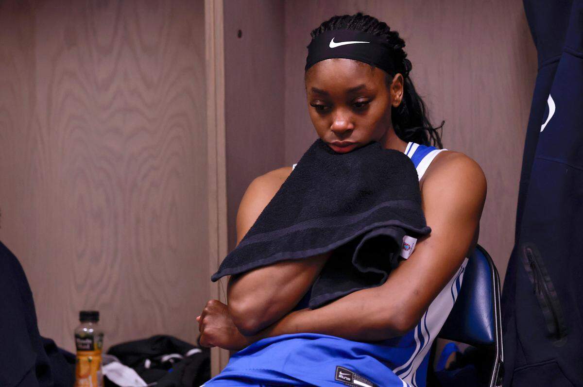 Duke’s Oluchi Okananwa sits in the locker room following the Blue Devils’ 54-50 loss to South Carolina in the NCAA Tournament Elite Eight at Legacy Arena on Sunday, March 30, 2025, in Birmingham, Ala.